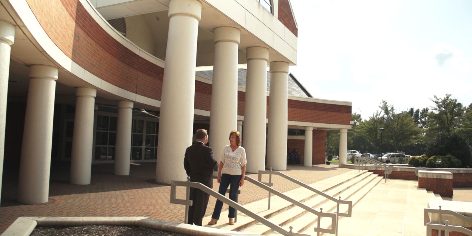 Burnett @ Williams Lawyer Consults With Client On Steps