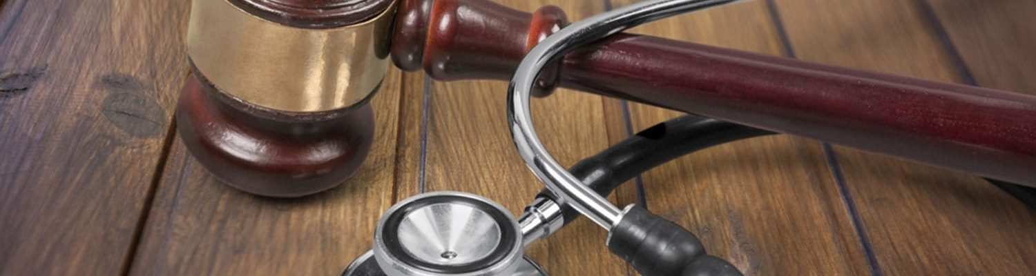 Gavel and Stethoscope on Desk