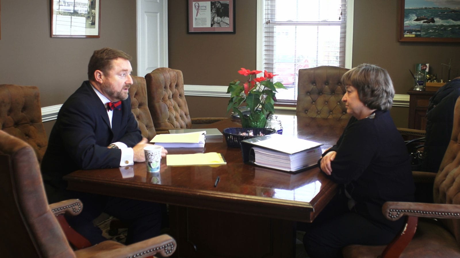 a picture of an auto accident lawyer serving a client in Richmond, Va