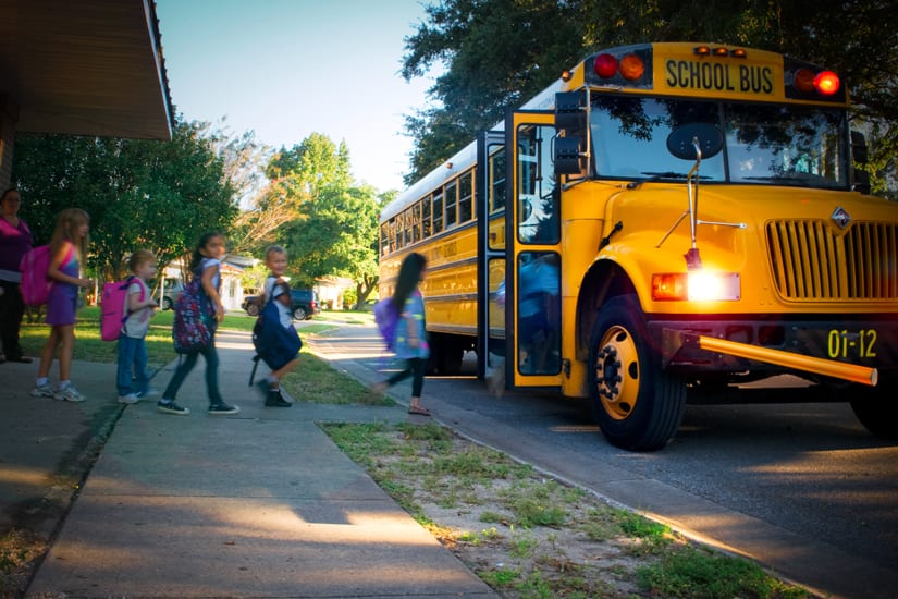 Children Cuing For The School Bus