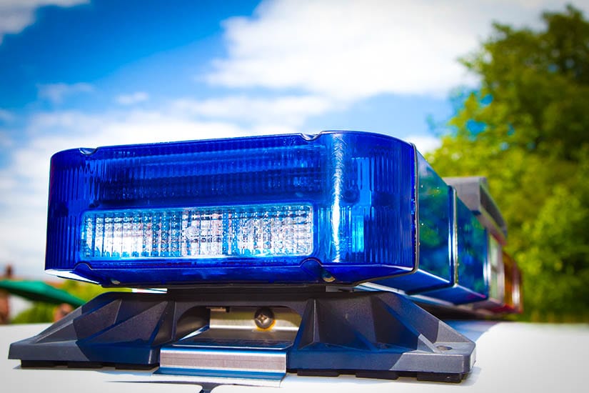 Closeup Of The Top Of A Police Cruiser Showing The Emergency Lights
