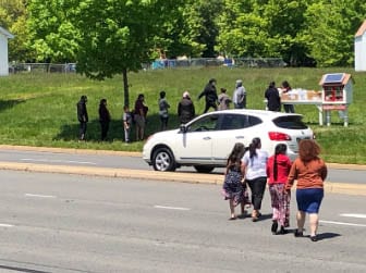 People Accepting Food From The Ampersand Food Pantry