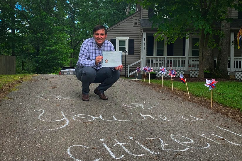 David Brown Crouching with US Citizen paperwork