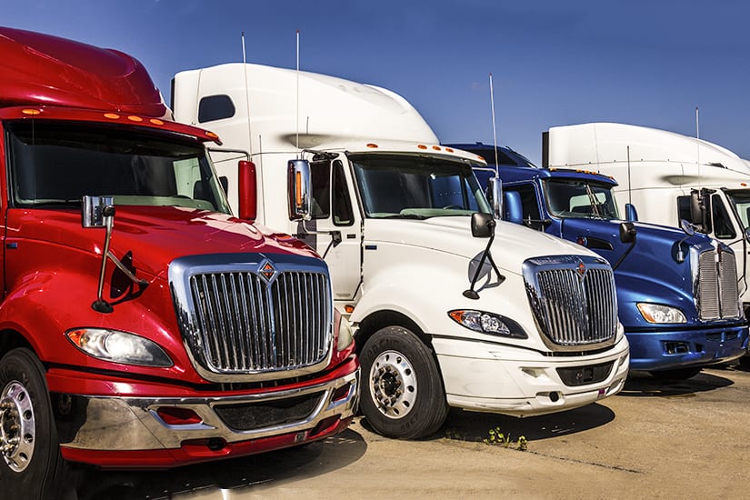 truck cabs lined up in lot