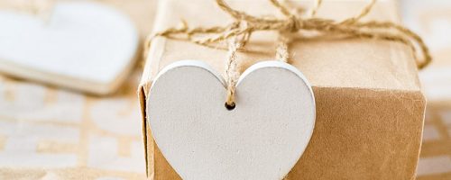 A Package With A Wooden Heart Tab